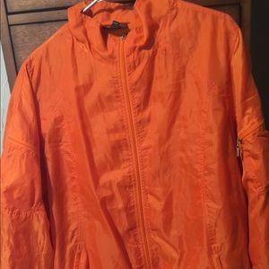 Lite weight orange rain jacket.